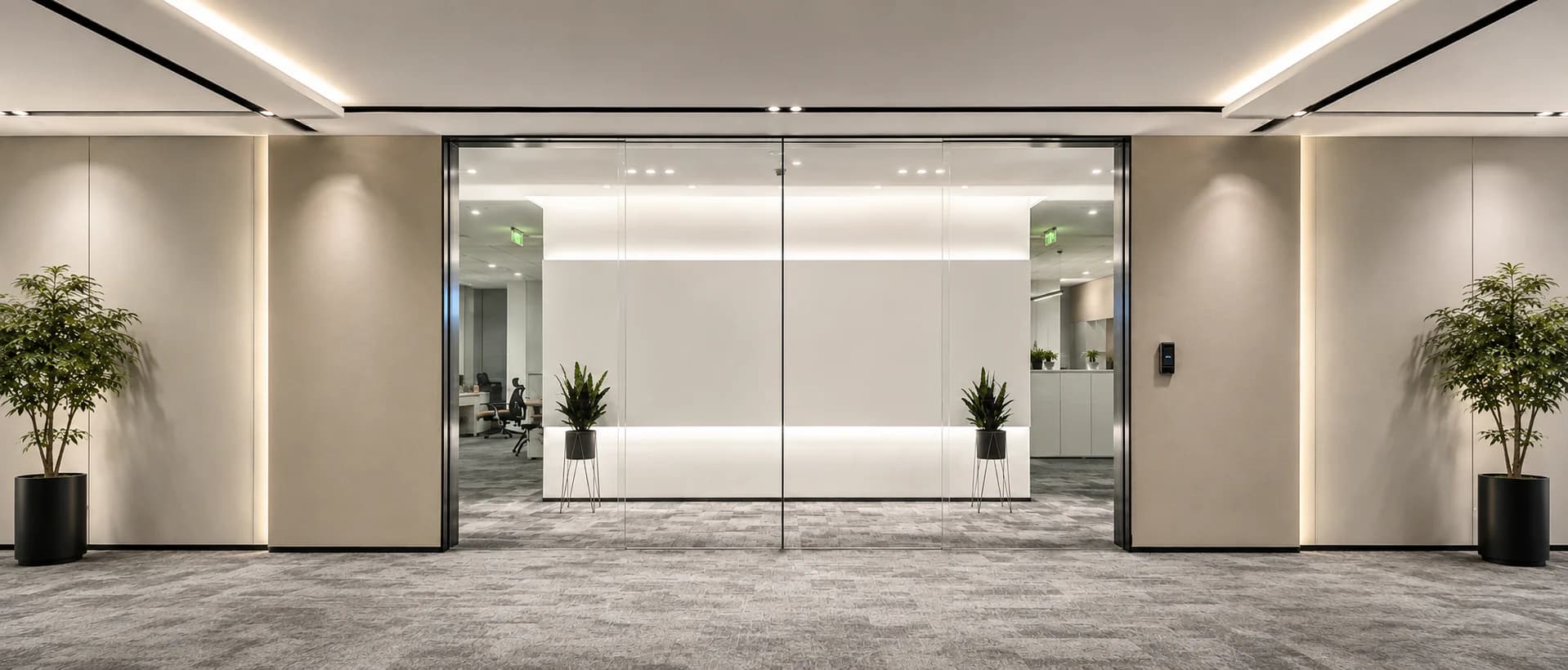 All-glass automatic sliding doors across a transparent office entrance