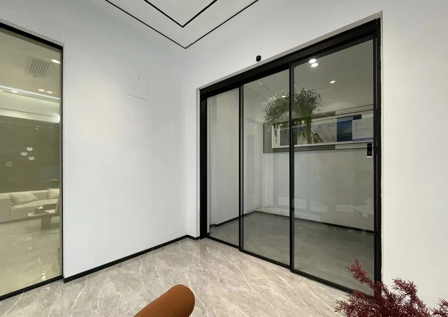 Black framed automatic sliding glass door