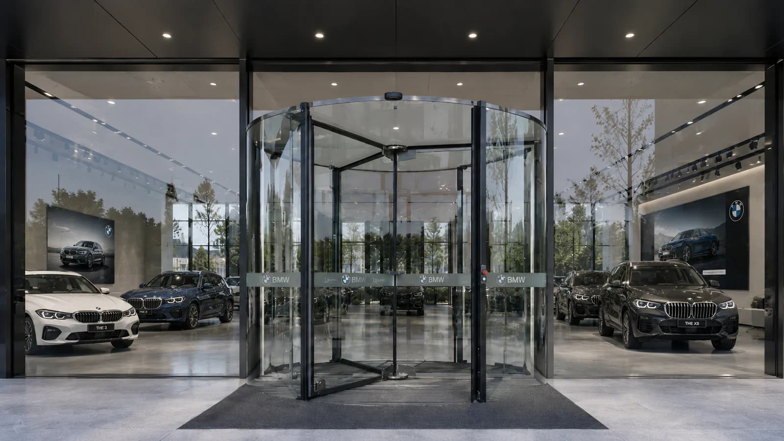 All-glass automatic revolving door at an automobile showroom