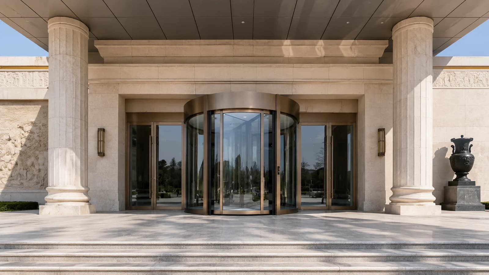 Automatic revolving glass door at a museum entrance